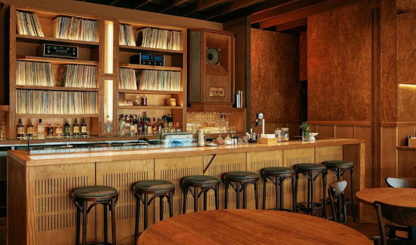 Intimate bar interior at Maru Hi-Fi with DJ setup and vinyl records