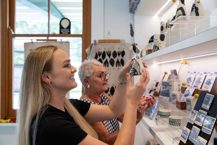 Shoppers looking at artisan ceramics at Newcastle VIC