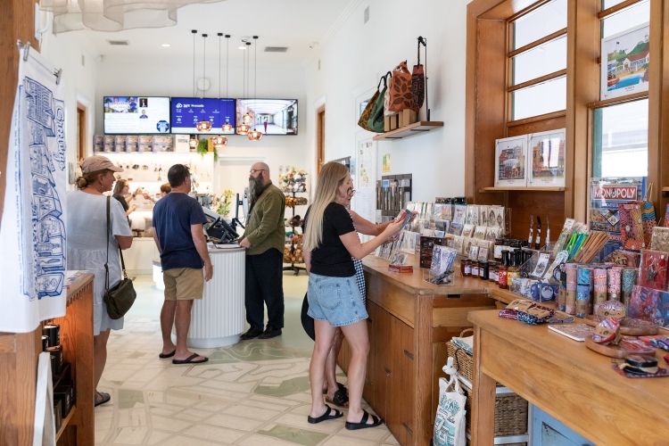 Shoppers browsing souvenirs at Newcastle's Visitor Information Centre