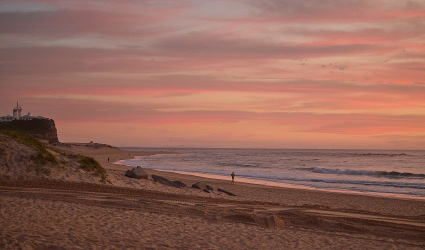 Sunrise over Nobbys Beach and Nobbys Headland in Newcastle.