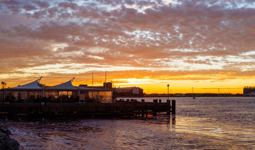 Queens Wharf Hotel overlooking the harbour at sunset